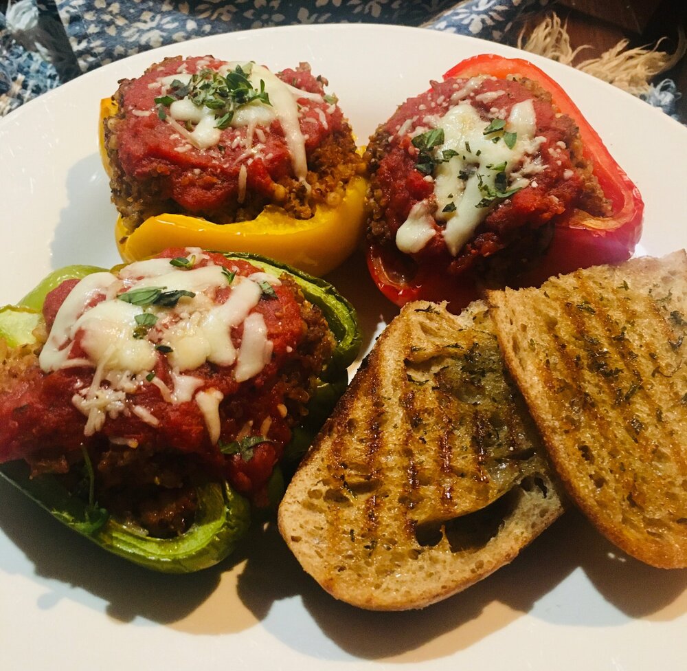 Red, yellow and green Stuffed Peppers served with seasoned, grilled home-made sourdough.